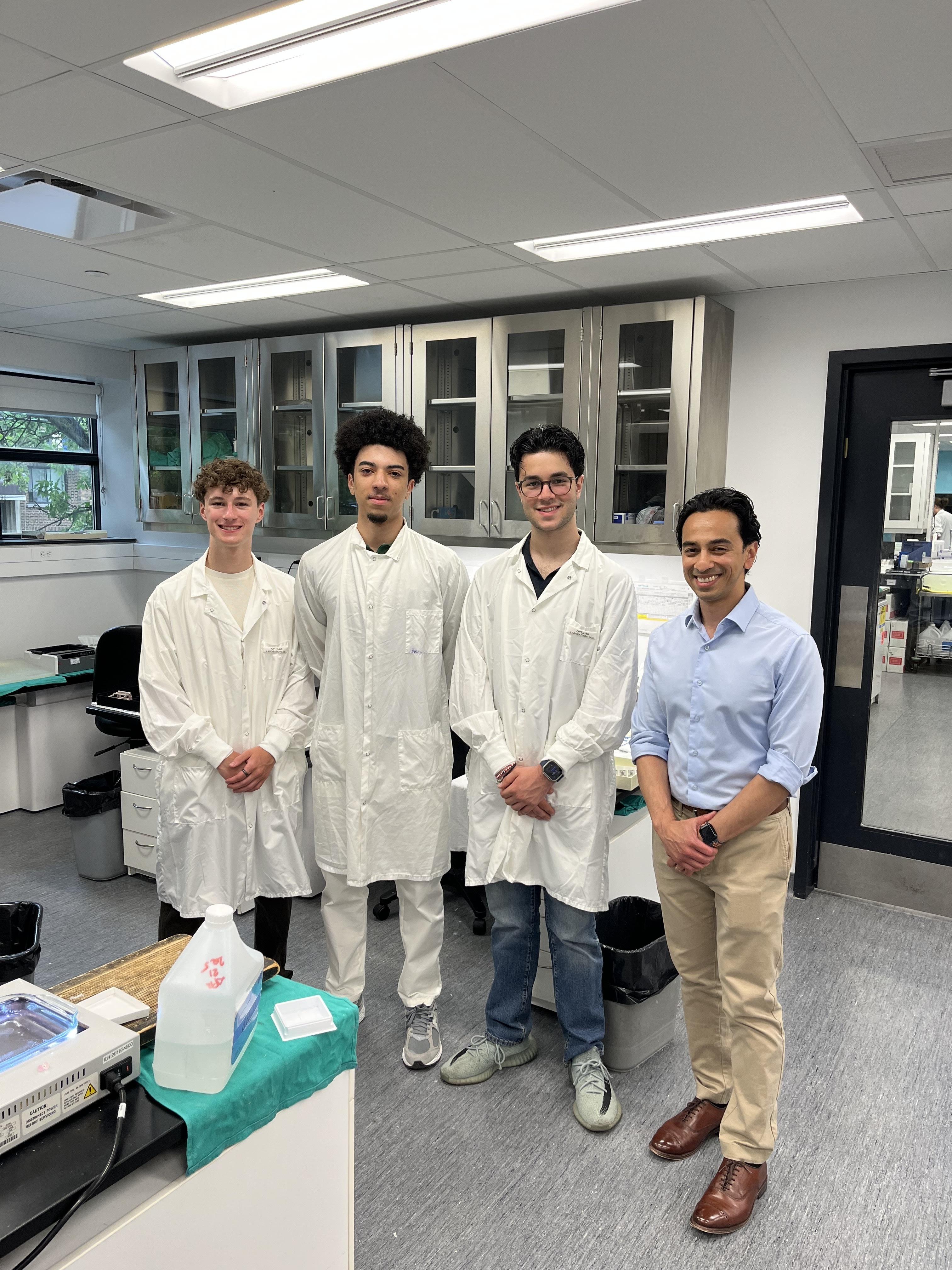 The four founders in a histology lab